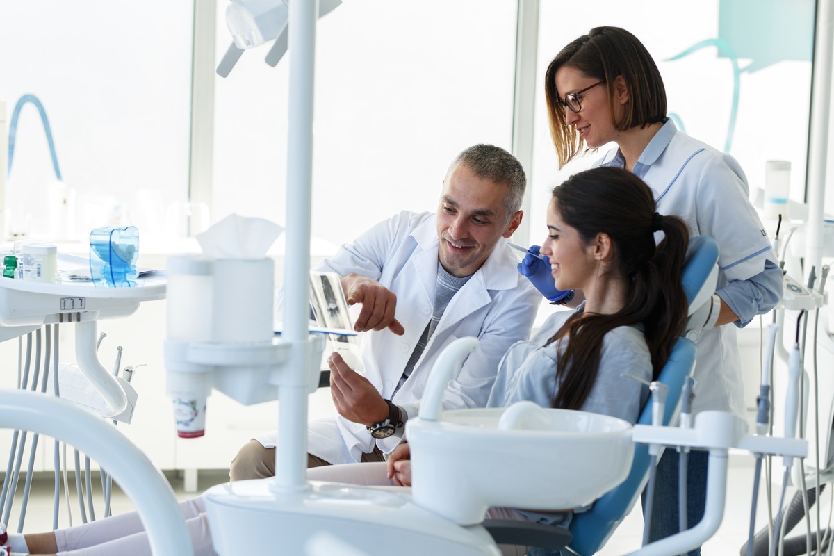 Dentist consulting with a patient about a dental treatment plan